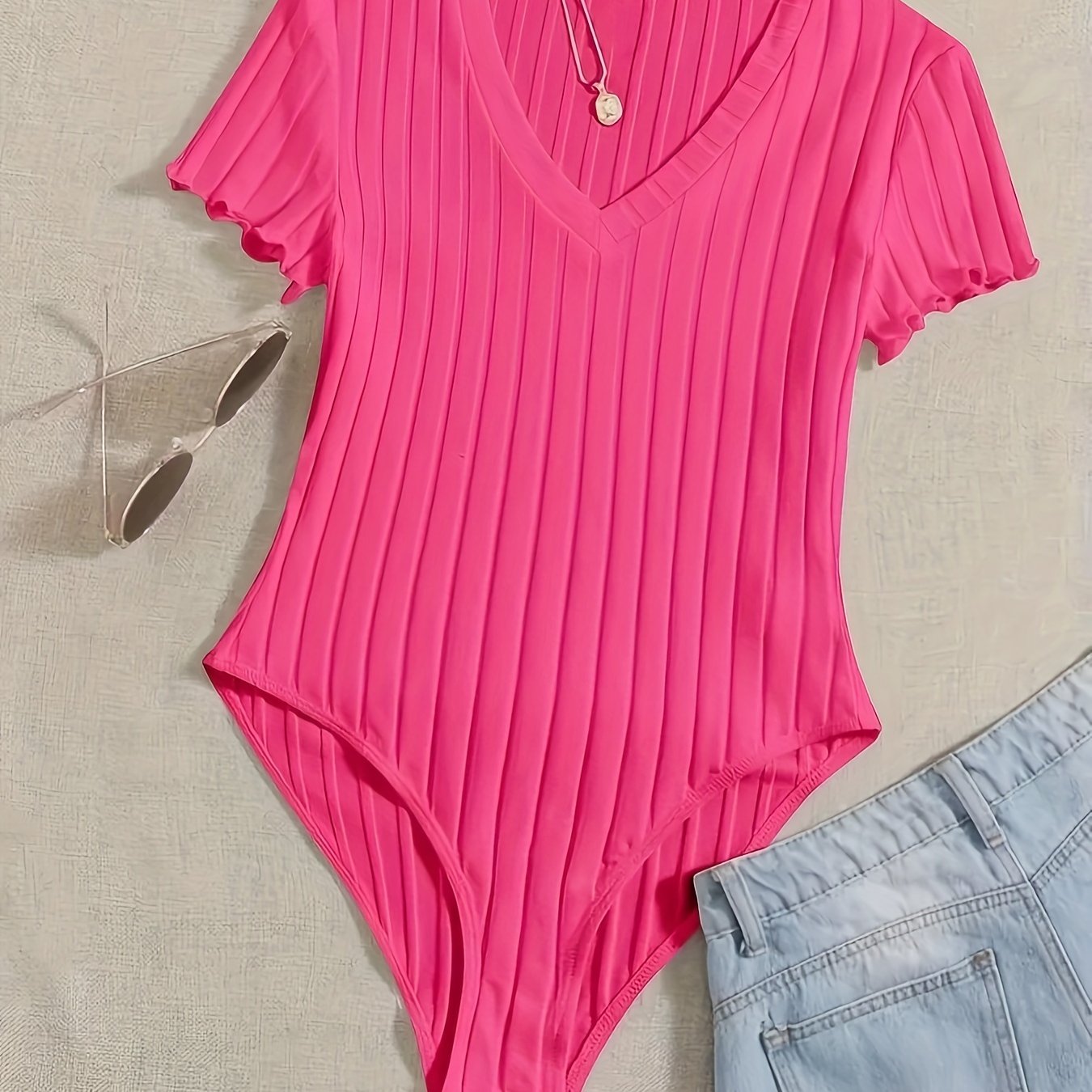 Stijlvolle effen V-hals body van hoogwaardig katoen | Shop nu! afbeelding 13