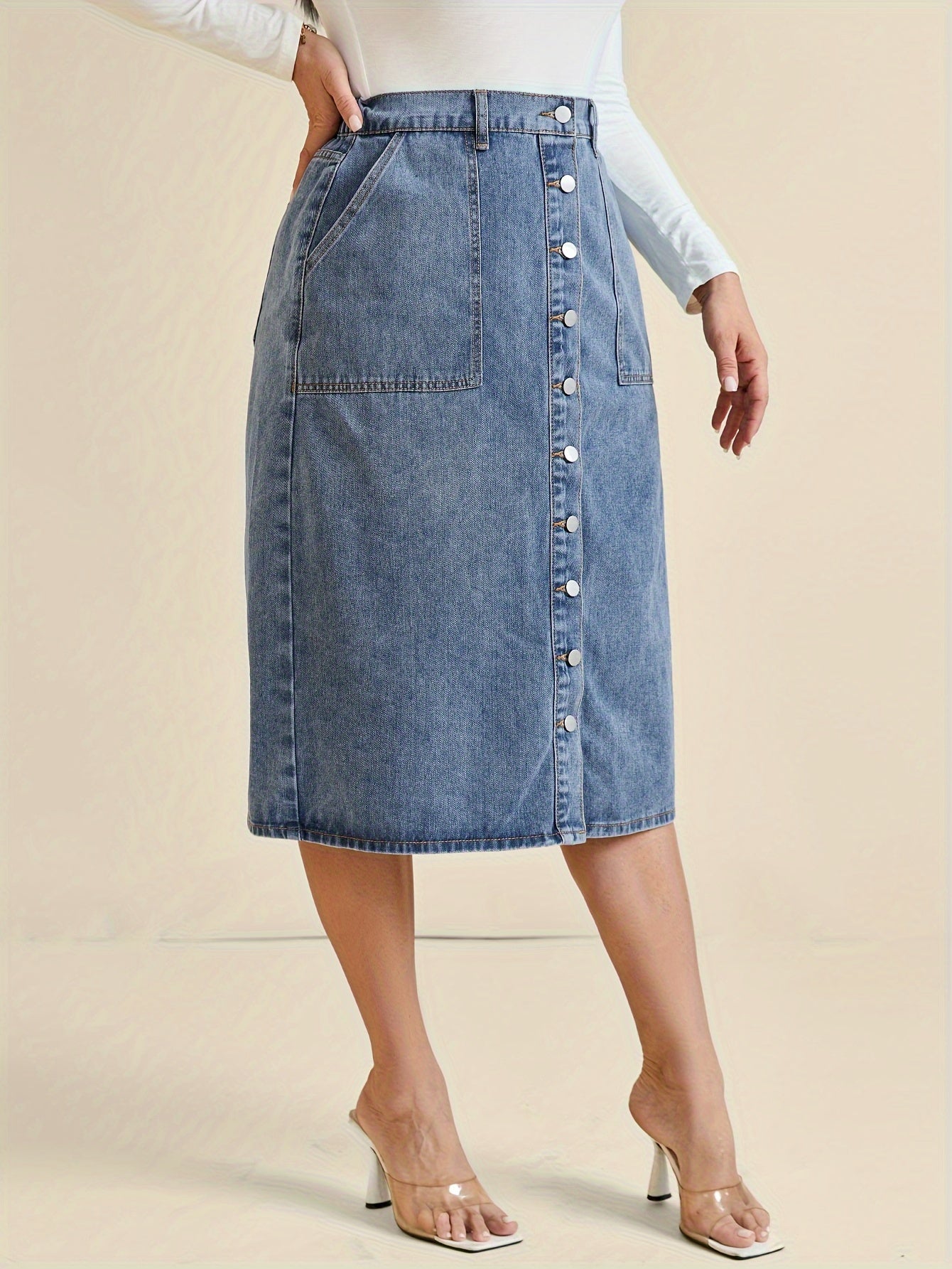 Koop de perfecte midi-denimrok met knoopdetail - tijdloos en stijlvol! afbeelding 5