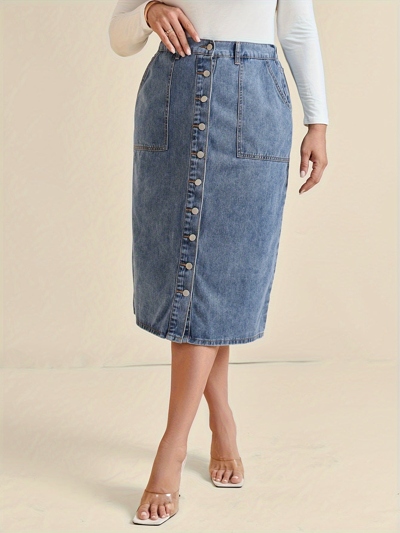Koop de perfecte midi-denimrok met knoopdetail - tijdloos en stijlvol! afbeelding 4