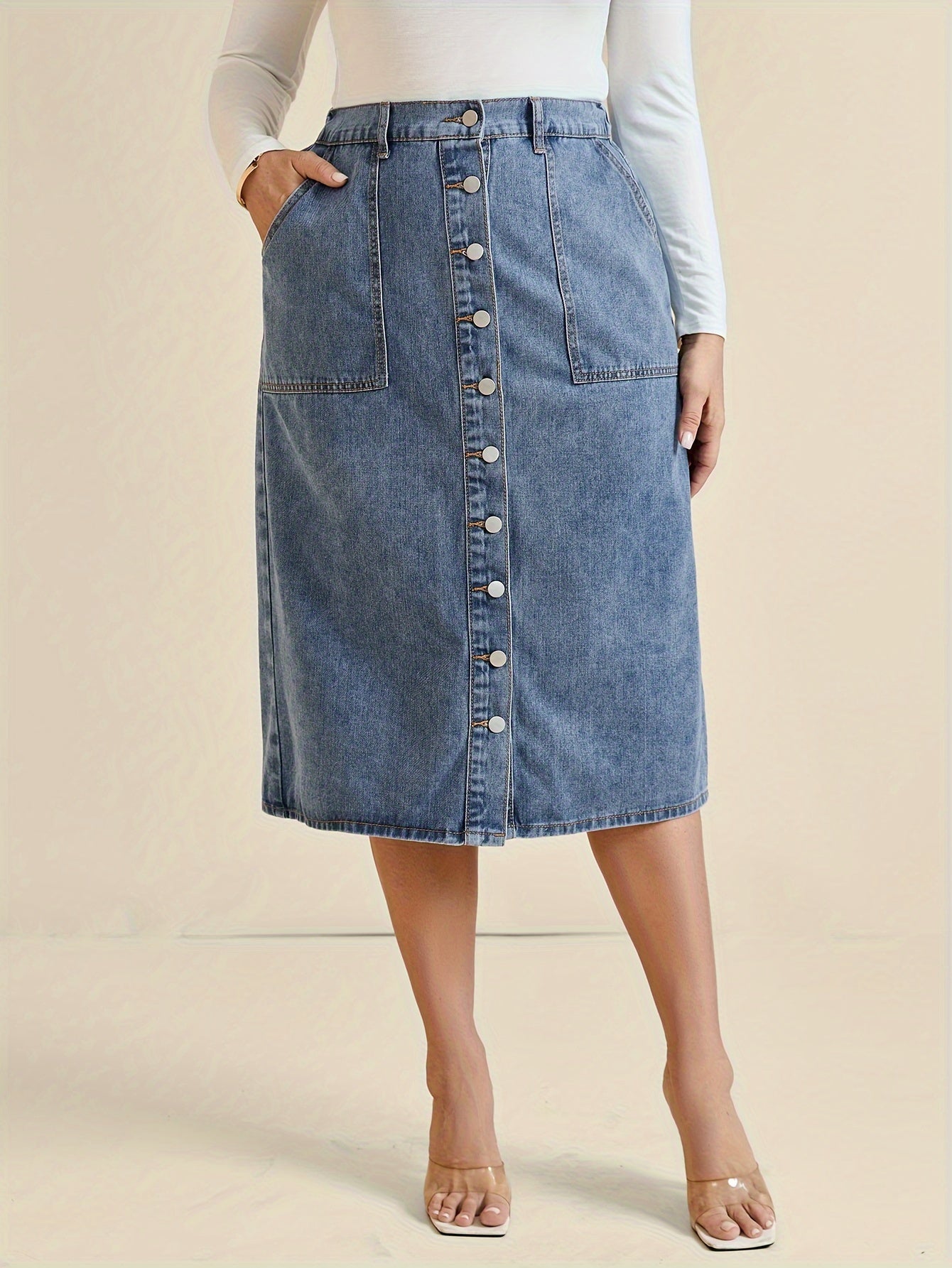 Koop de perfecte midi-denimrok met knoopdetail - tijdloos en stijlvol! afbeelding 2