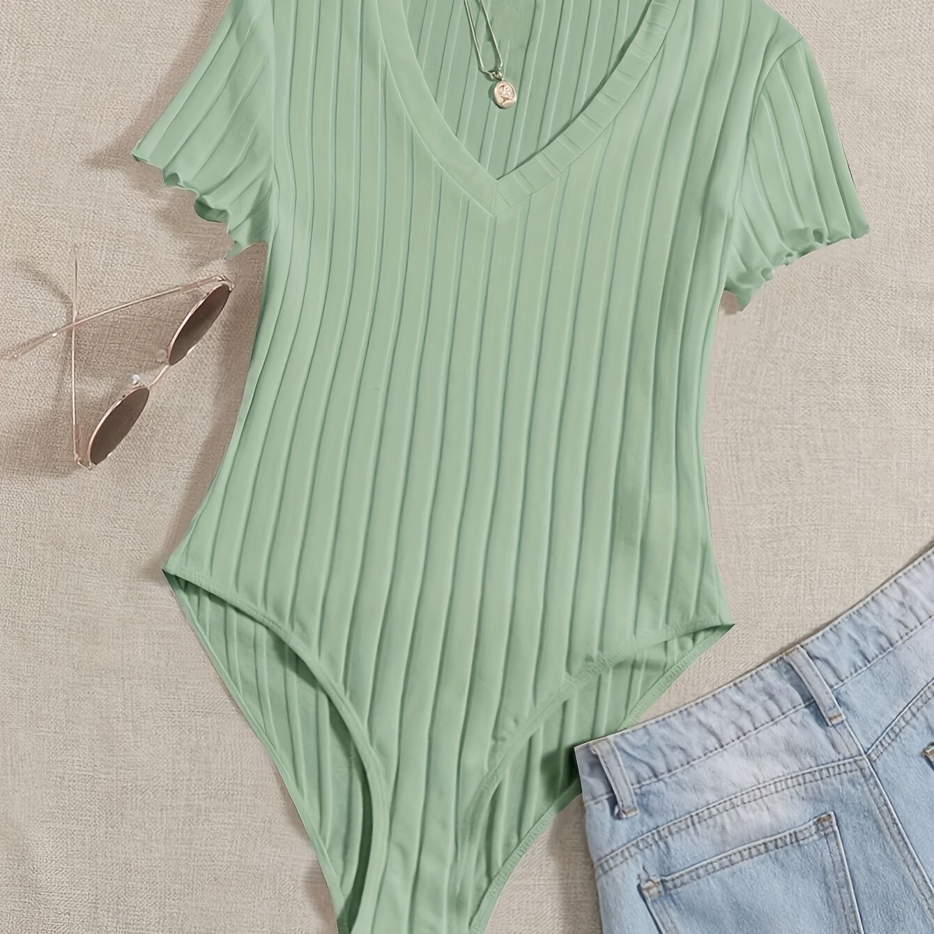 Stijlvolle effen V-hals body van hoogwaardig katoen | Shop nu! afbeelding 17