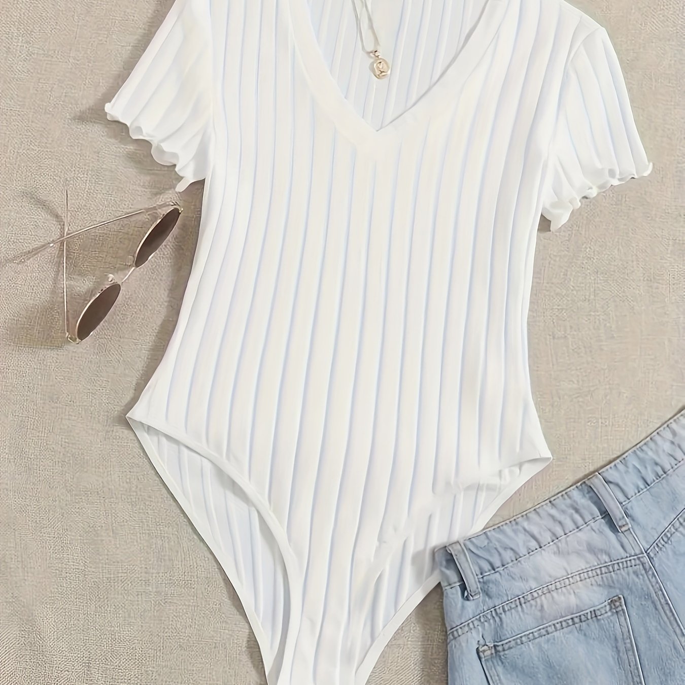 Stijlvolle effen V-hals body van hoogwaardig katoen | Shop nu! afbeelding 12