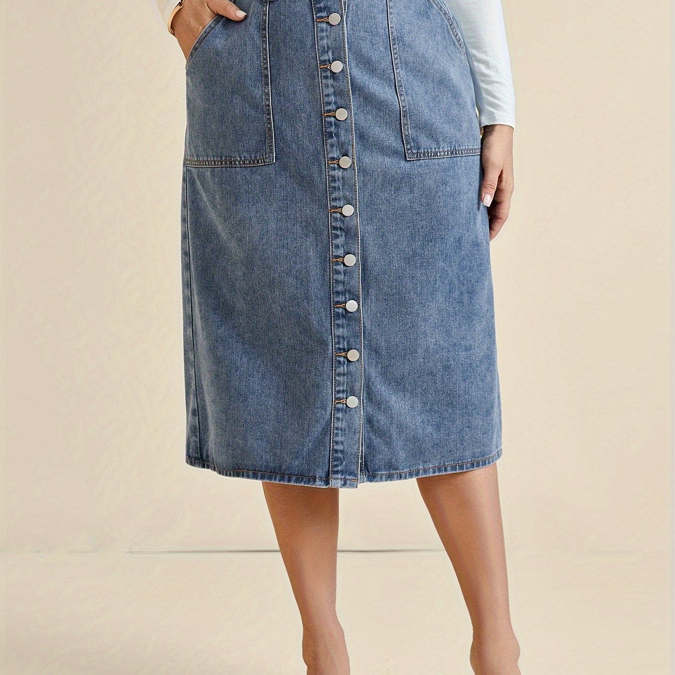 Koop de perfecte midi-denimrok met knoopdetail - tijdloos en stijlvol! afbeelding 7